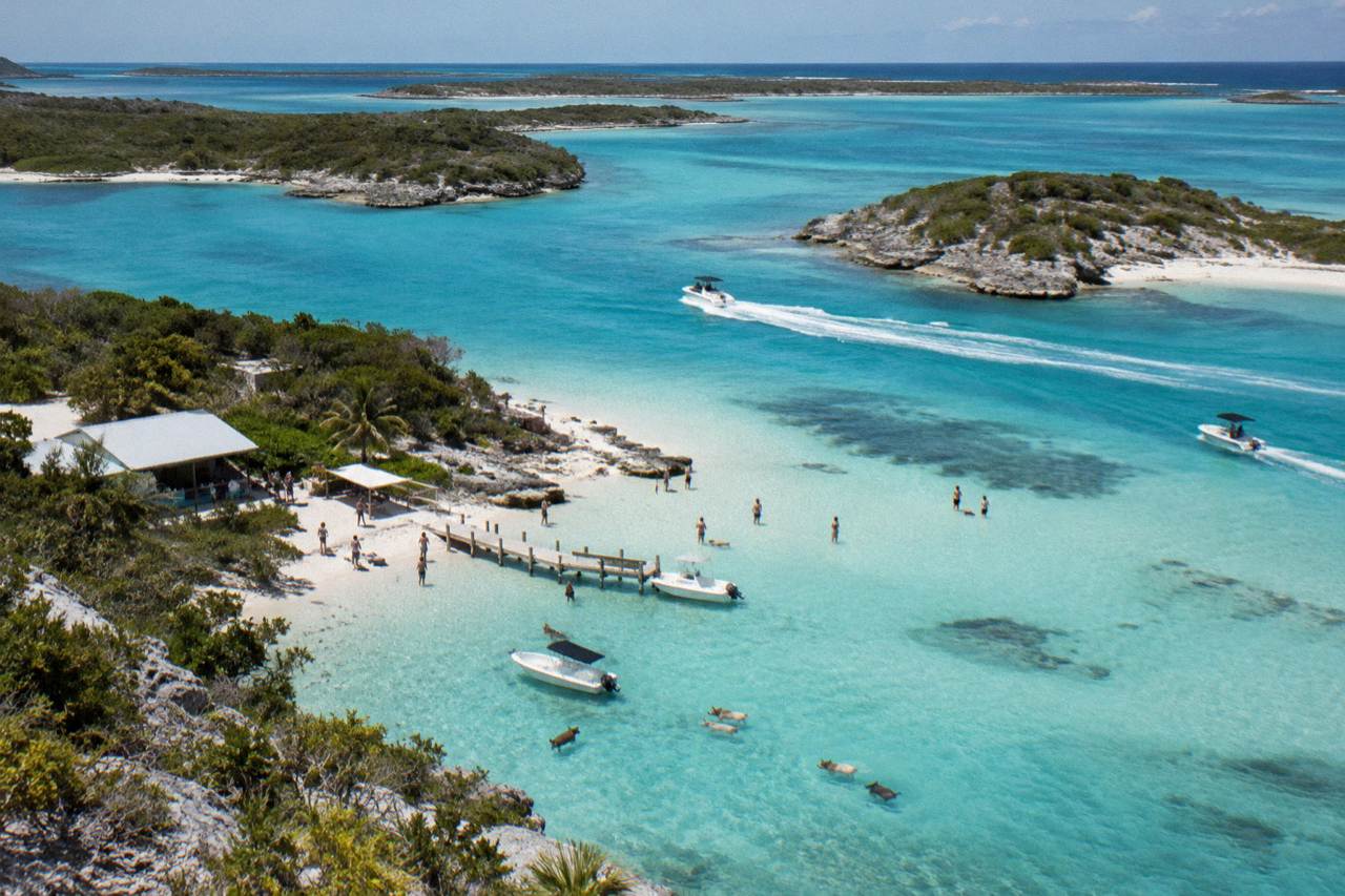 Turquoise shallow water and small cays along the Exuma chain seen from a boat